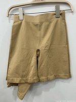 Unwrapped tan tummy control short on hanger