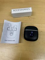 Earbuds charging case, accessories box, user guide