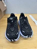 Top view of both Hoka Kawana shoes showing uppers, laces, and color