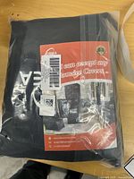 Front view of sealed Kipiea patio sofa cover package