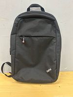 Front view of Lenovo ThinkPad backpack showing logo and zippered pocket