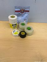 All six tape rolls and sealed package grouped