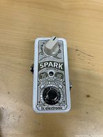 Top view showing graphics, footswitch, level knob, brand and model