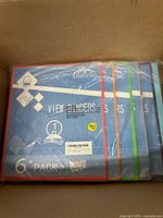 Shrink-wrapped six-pack assorted color 1" view binders inside box