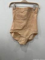 Unpackaged sample showing full high-waist tummy control brief front view