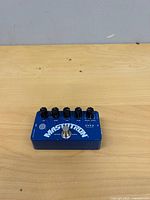 Top view showing blue ZVEX Mastotron pedal with five knobs and footswitch