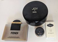 Four items: Fendi gel bottle, Joy de Bain jar, Paloma Picasso sample jar, Givenchy boxed miniature