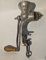 Full view of Husqvarna Scandia No.2 meat grinder showing crank, clamp, and funnel