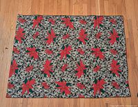 Full view of rectangular tablecloth laid flat, showing overall pattern