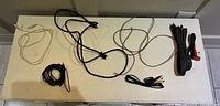 All cables laid out on tabletop showing quantity, colours and approximate lengths