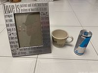 Mug, photo frame and scale reference shown together
