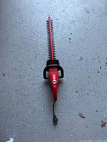 Full view of Homelite hedge trimmer showing entire length and power cord