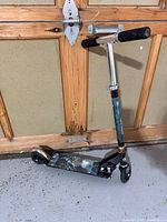 Full view of scooter standing upright