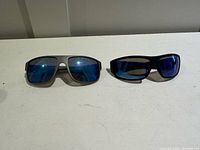 Both pairs of sunglasses side by side