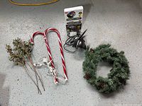 Full lot view including projector, candy canes, wreath, berry sprays