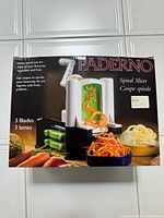 Front of Paderno Spiral Slicer retail box showing product image and 3 blades note