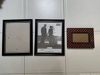 front view of three picture frames