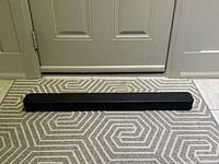 Front angled view of entire black Sony soundbar