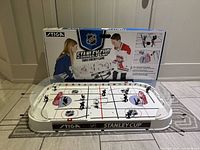 Overall view of assembled Stiga Stanley Cup tabletop hockey game with box