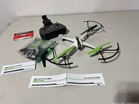 Drone, controller, batteries, spare parts bag, manuals overview