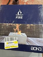 Front of boxed Bond Canmore square tabletop firebowl