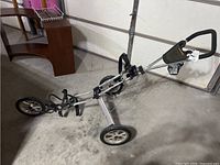 Golf push cart fully extended viewed from side