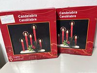 Two boxed Holiday Collection 5-light electric candelabras