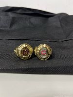 Front view of both rings showing team crests