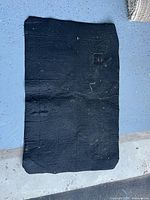 Full view of black mat front side showing bevelled corner and flap