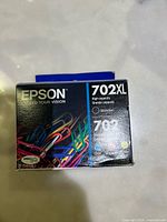 Boxed Epson 702XL high-capacity black ink cartridge front view