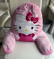 Front view of Hello Kitty bed rest pillow showing design and condition