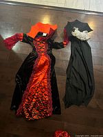 Full layout of dress, cape and hood