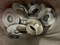 Bag containing multiple recessed light trims and baffles