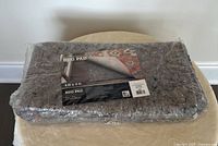 Sealed rug pad package front view with label showing size 4x6