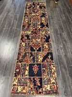 Full view of entire patchwork runner on wood floor
