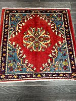 Full view of square Hamadan rug showing colours, pattern and size