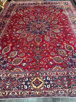 Full view of entire rug showing size, design and overall wear