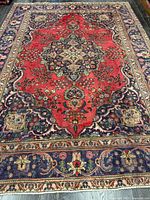 Full view of Persian Tabriz rug showing overall design and size