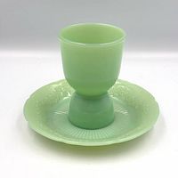 Egg cup assembled on saucer, showing color and design