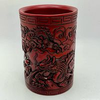 Front view showing carved dragon and cloud design