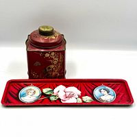 Both red tin items together front view