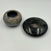Both stone votive holders side by side