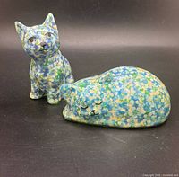 Both cat figurines front view