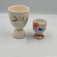 Front view of both egg cups showing designs and size comparison