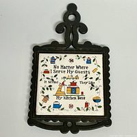 Front view showing ceramic tile design and iron frame