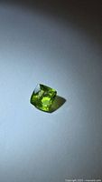 Front view of cushion-cut peridot gemstone