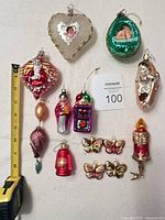 All 13 ornaments displayed with tape measure