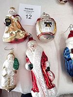 Five ornaments laid out on surface for overview