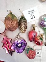 Group view of seven glass ornaments