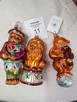 Front view of three glass animal ornaments